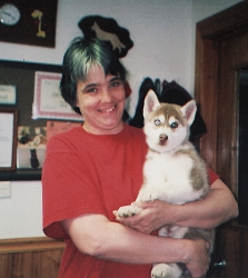 Penny with a Siberian Husky puppy.